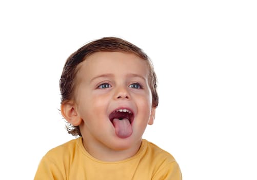 Adorable small child showing his tongue isolated on a white background