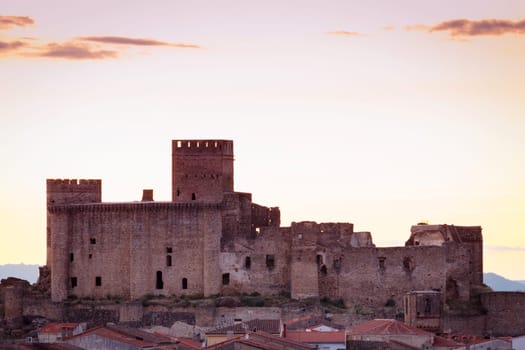Silhouette of a amazing castle over a yellow sky