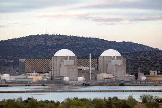 Almaraz, nuclear power plant in the center of Spain, surrounded by a green field