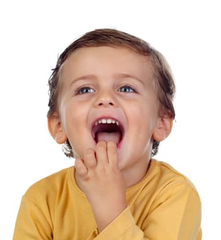 Adorable small child two years old sucking his hand