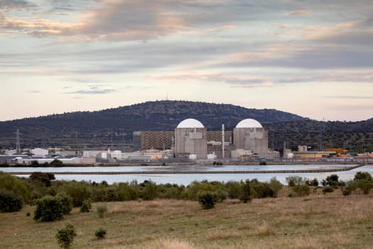 Almaraz, nuclear power plant in the center of Spain, surrounded by a green field