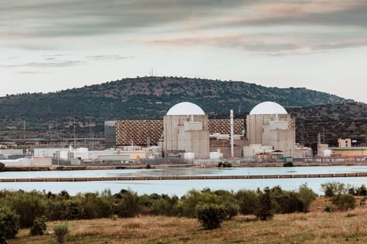 Almaraz, nuclear power plant in the center of Spain, surrounded by a green field