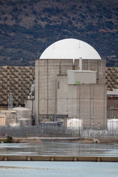 Almaraz, nuclear power plant in the center of Spain, surrounded by a green field