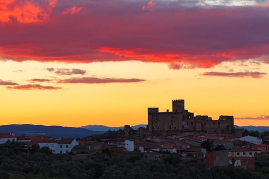 Silhouette of a amazing castle over a yellow sky
