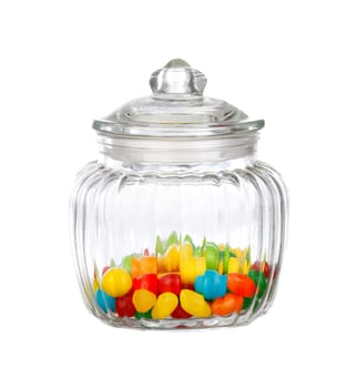 Nice glass container with candies isolated on a white background