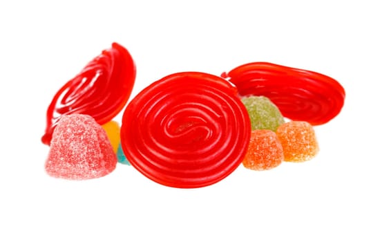 Red spiral of licorice and jelly beans isolated on a white background