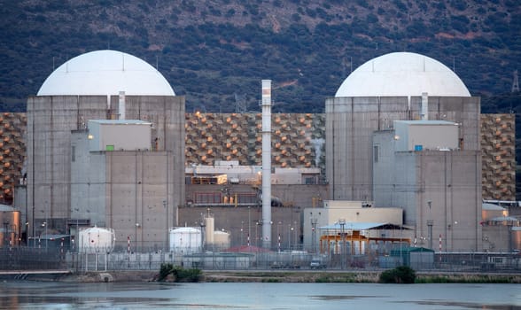 Almaraz, nuclear power plant in the center of Spain, surrounded by a green field