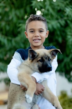 Latin child with his dog in a park
