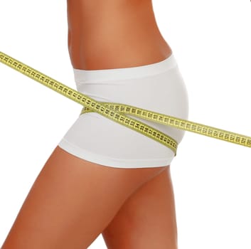 Beautiful body woman measuring her body isolated on a white background