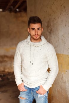 Portrait of attractive guy in a old house
