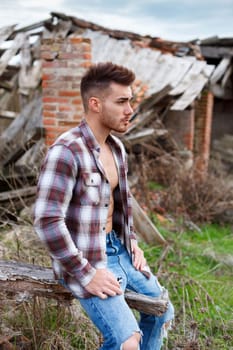 Attractive guy with the plaid shirt unbuttoned