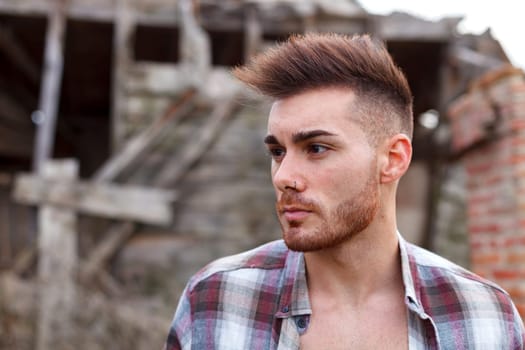 Attractive guy with the plaid shirt unbuttoned