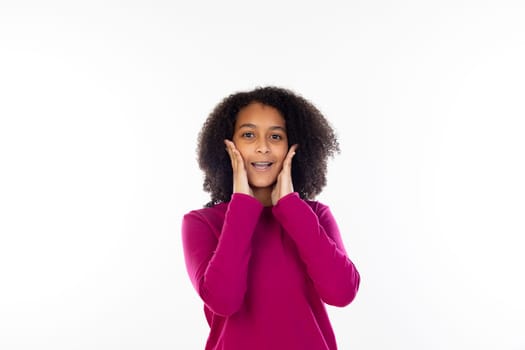 Beautiful teenager girl with pink sweater isolated on a white background