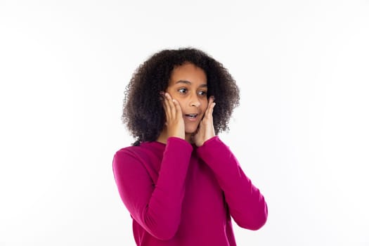 Beautiful teenager girl with pink sweater isolated on a white background