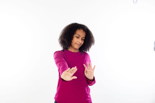 Beautiful teenager girl with pink sweater isolated on a white background