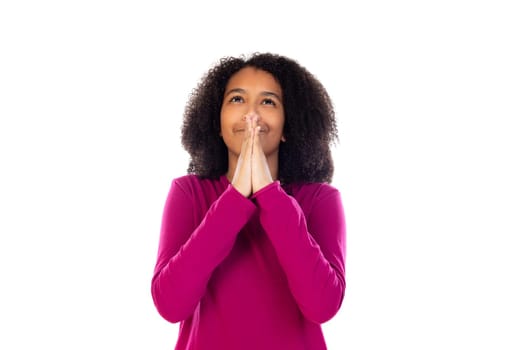 Teenager girl with afro hair wearing pink sweater isolated on a white background