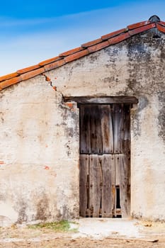 Old wooden door a with rusty lock