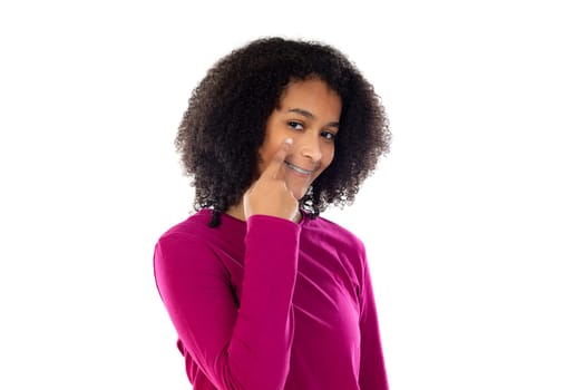 Beautiful teenager girl with pink sweater isolated on a white background