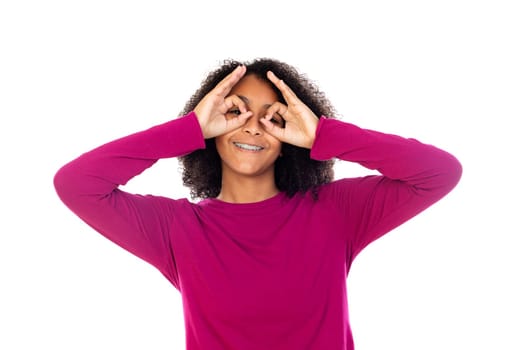 Beautiful teenager girl with pink sweater isolated on a white background