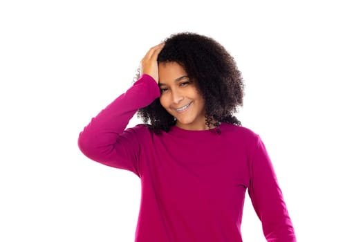 Teenager girl with afro hair wearing pink sweater isolated on a white background