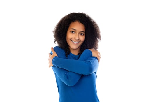 Teenager girl wearing blue sweater isolated on a white background