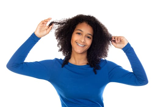 Teenager girl with afro hair wearing blue sweater isolated on a white background