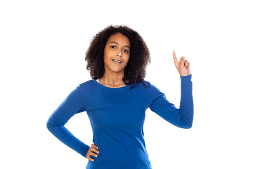 Teenager girl with afro hair wearing blue sweater isolated on a white background