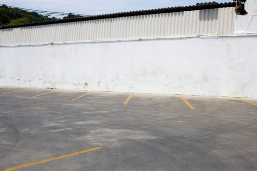 empty  parking lot white wall