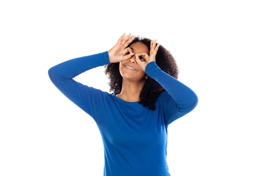 Teenager girl with afro hair wearing blue sweater isolated on a white background