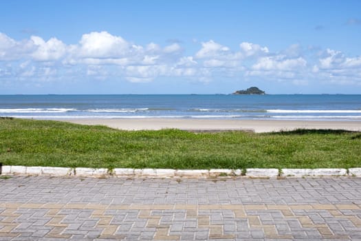 green grass empty beach Guaruja Brazil