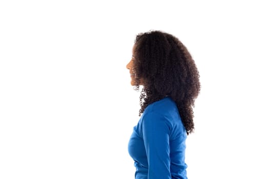 Teenager girl with afro hair wearing blue sweater isolated on a white background