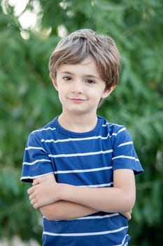 Adorable small child in the field looking at camera