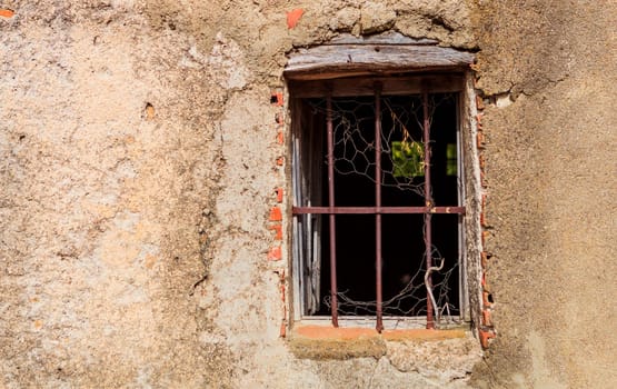 Ruined window of an abandoned house