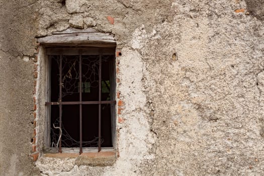 Ruined window of an abandoned house