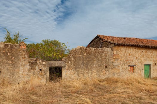 Ruined houses in the middle of the field