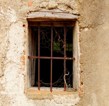 Ruined window of an abandoned house