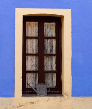 Old house with a red door weathered wood