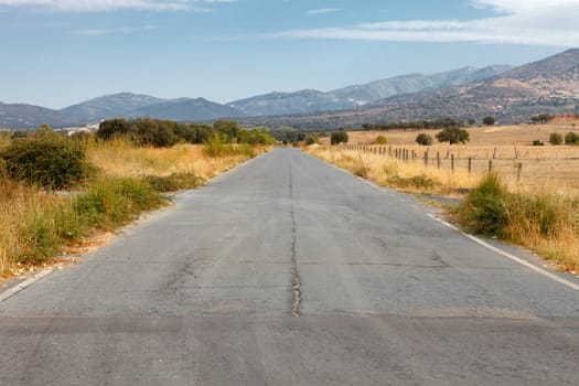 View of a secondary road with many cracks