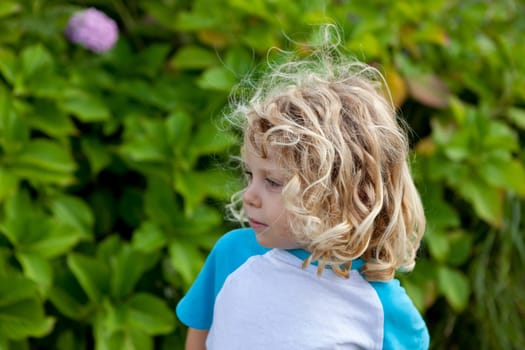 Beautiful boy four year old with long blond hair