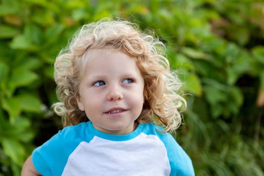 Beautiful boy four year old with long blond hair