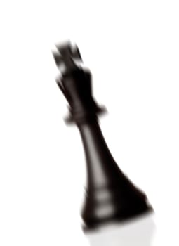 Chess piece king falling isolated on a white background