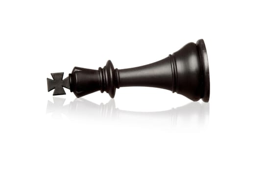 Chess piece king falling isolated on a white background