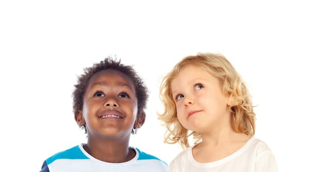 Two funny children looking up isolated on a white background