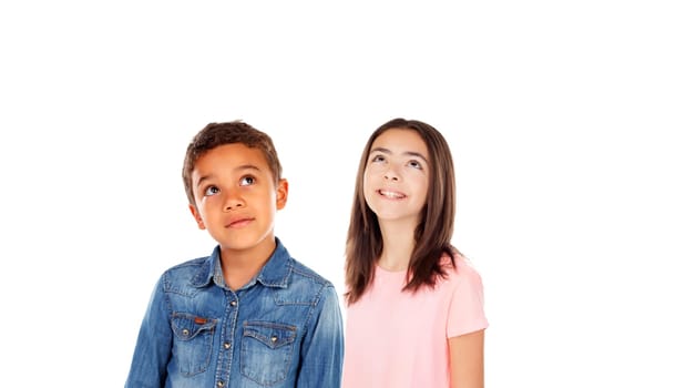 Pensive children looking up isolated on a white background