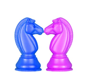 Blue and pink knights face to face. Symmetrical pieces of chess