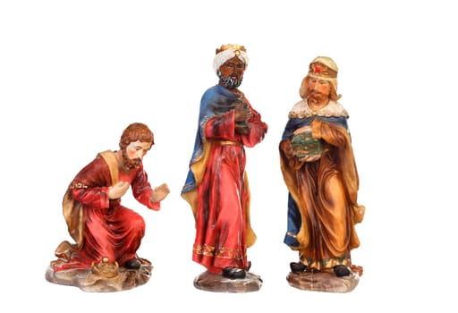 The three wise men. Ceramic figures isolated on white background