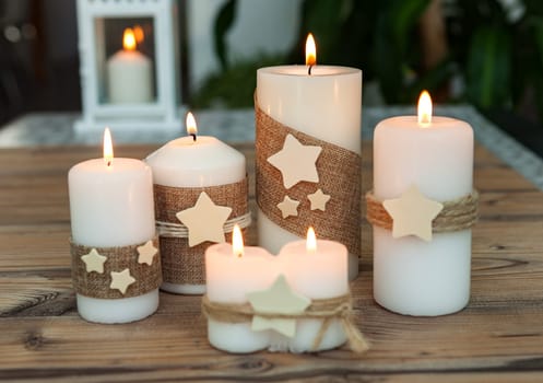 Beautiful Candles in home. Warm christmas decoration