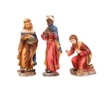 The three wise men. Ceramic figures isolated on white background