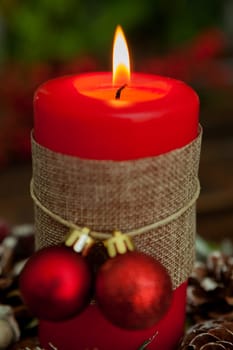 Candle for Christmas in red. Beautiful Holidays decoration