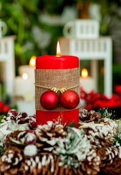 Candle for Christmas in red. Beautiful Holidays decoration